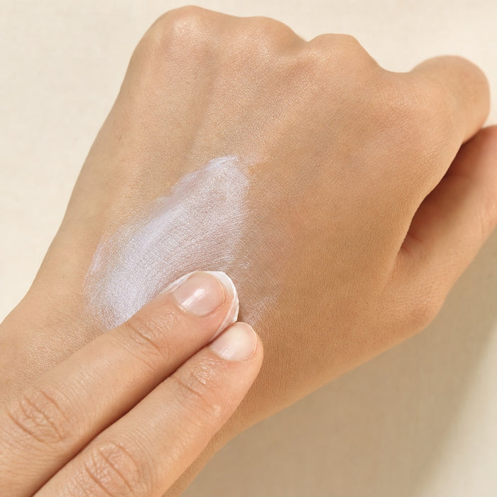 The cream spreading into a sheer film